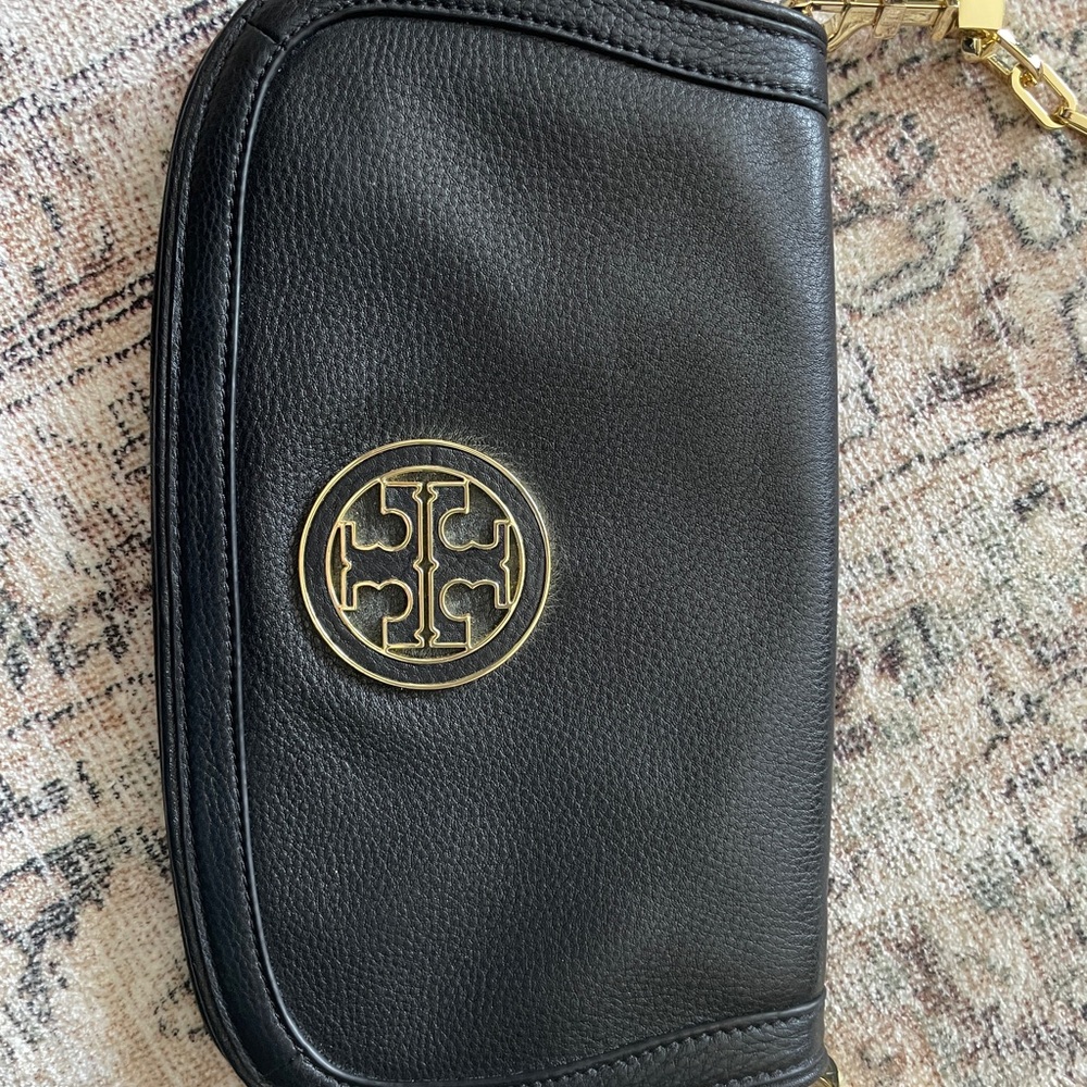 Tory Burch Black and  Gold Leather Purse. Never used .